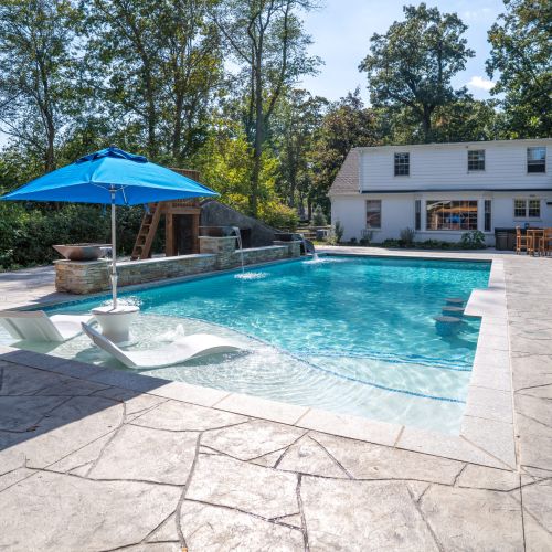 Close-up of pool with recliner shelf